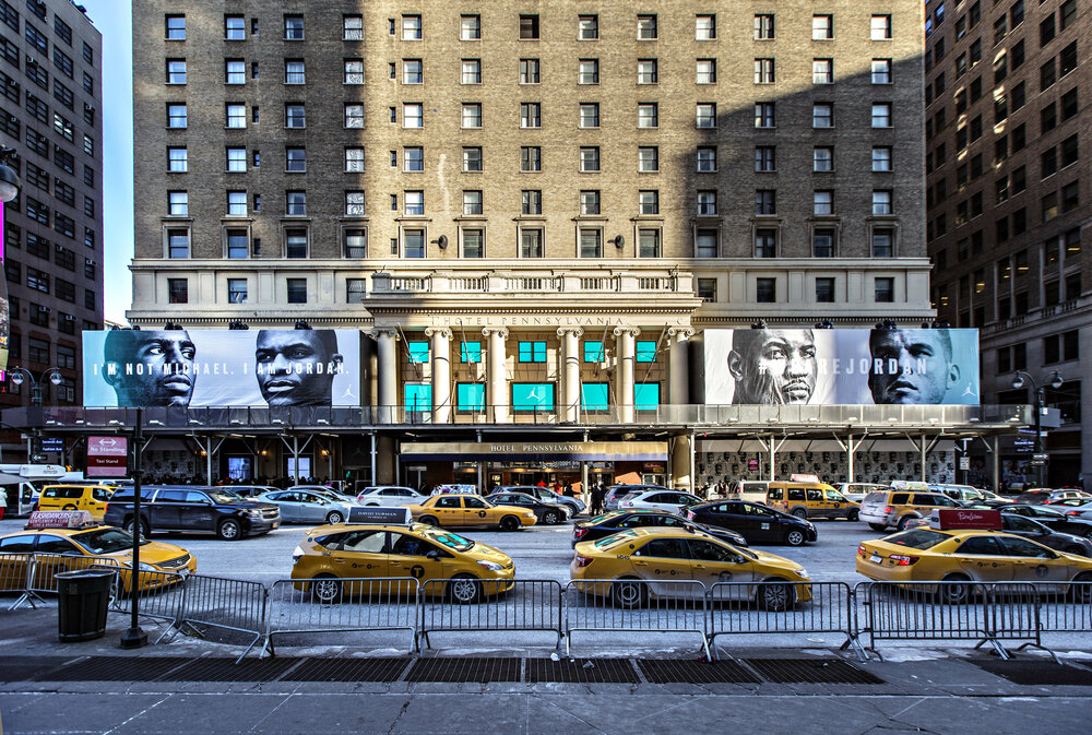Hotel Pennsylvania building wrap — Jordan Brand banners across 7th Ave